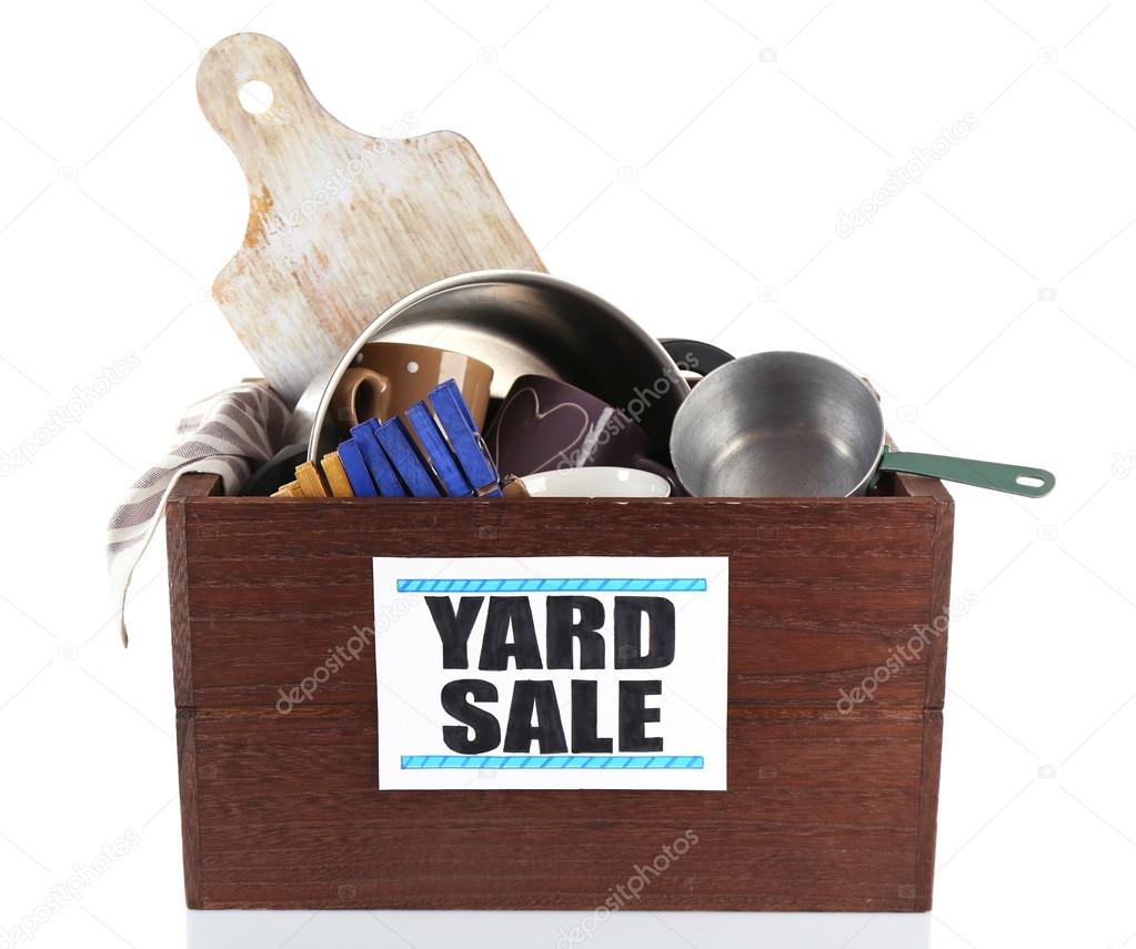 Box of unwanted stuff ready for yard sale isolated on white