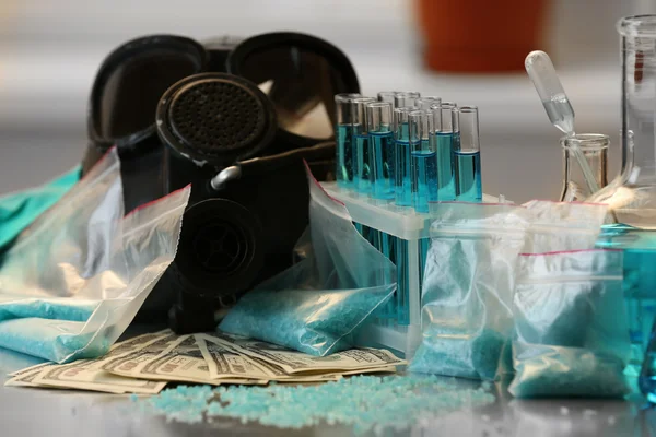 Blue  methamphetamine and money on table — Stock Photo, Image
