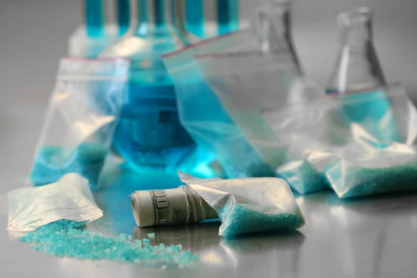 Blue methamphetamine and money — Stock Photo, Image