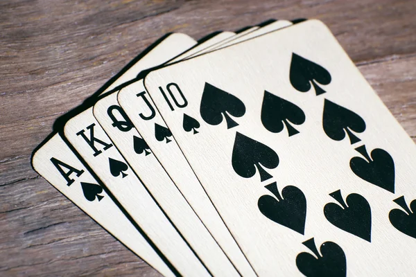 Playing cards on wooden table, closeup — Stock Photo, Image