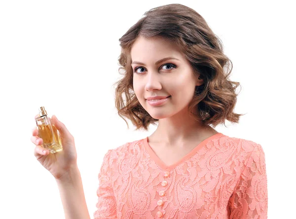 Hermosa mujer con frasco de perfume aislado en blanco — Foto de Stock