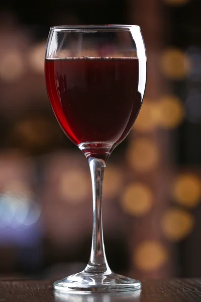 Glass of red wine on bar background — Stock Photo, Image