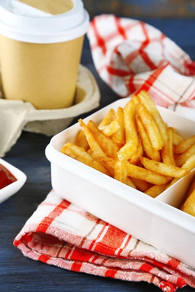 Tasty burger and french fries on wooden table background , close-up Unhealthy food concept — Stock Photo, Image