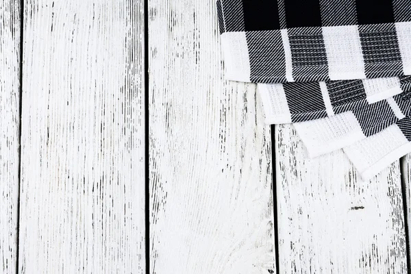 Checkered napkin on wooden table background — Stock Photo, Image