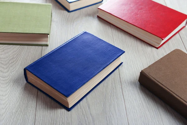 Heap of books on wooden background — Stock Photo, Image