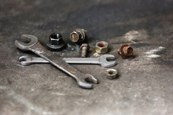 Wrenches and bolts on table — Stock Photo, Image