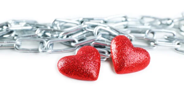 Two red hearts with metal chain isolated on white — Stock Photo, Image