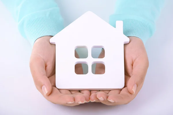 Female hands holding house, closeup — Stock Photo, Image