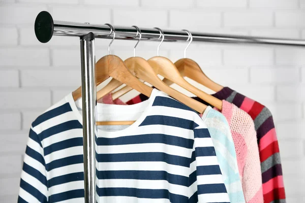 Different clothes on hangers — Stock Photo, Image