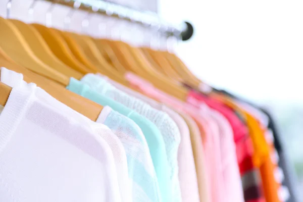 Different clothes on hangers — Stock Photo, Image