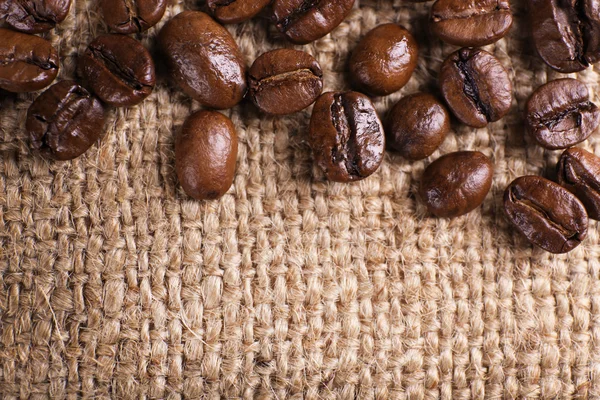 Frame of coffee beans on sackcloth — Stock Photo, Image