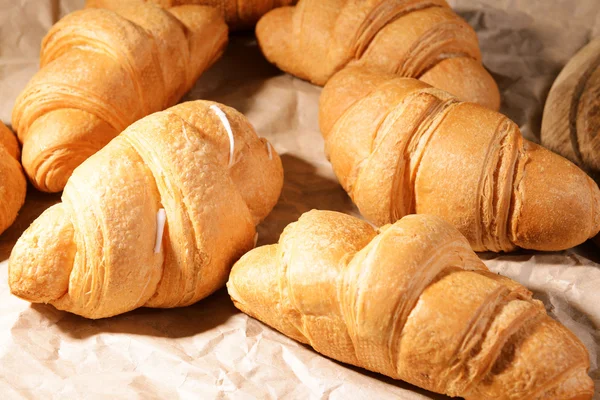 Delicious croissants on table — Stock Photo, Image