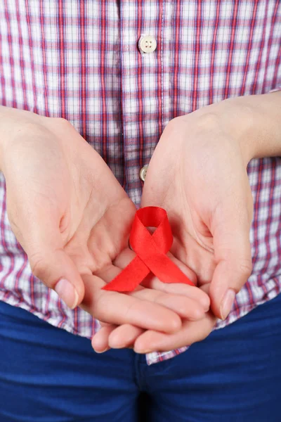 Female hands with color ribbon — Stock Photo, Image