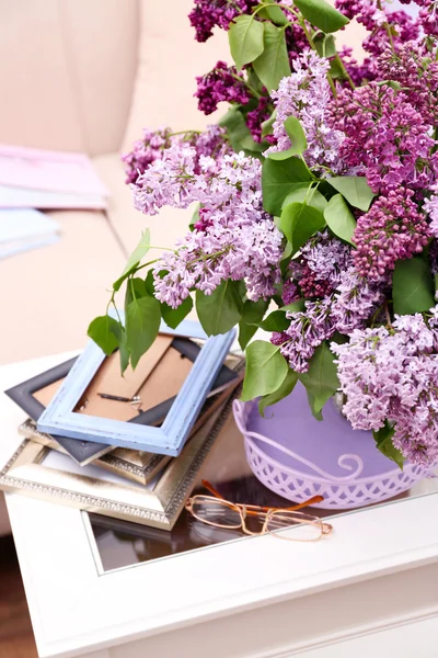 Beautiful lilac flowers in vase on table — Stock Photo, Image