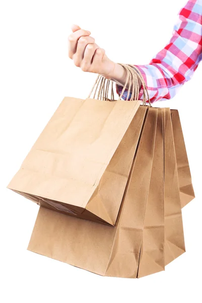 Woman holding paper shopping bag — Stock Photo, Image