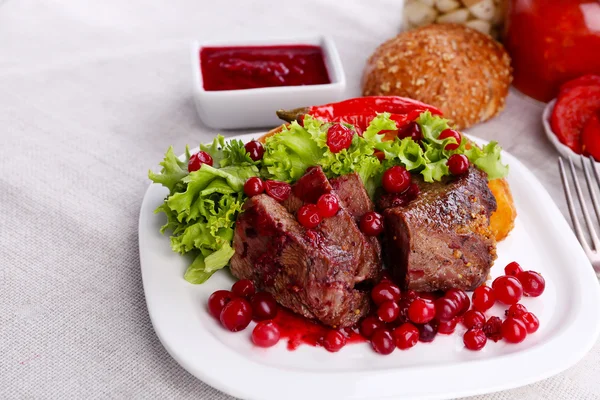 Tasty roasted meat with cranberry sauce — Stock Photo, Image