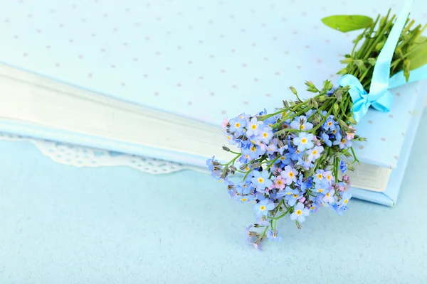 Forget-me-nots flowers on book — Stock Photo, Image