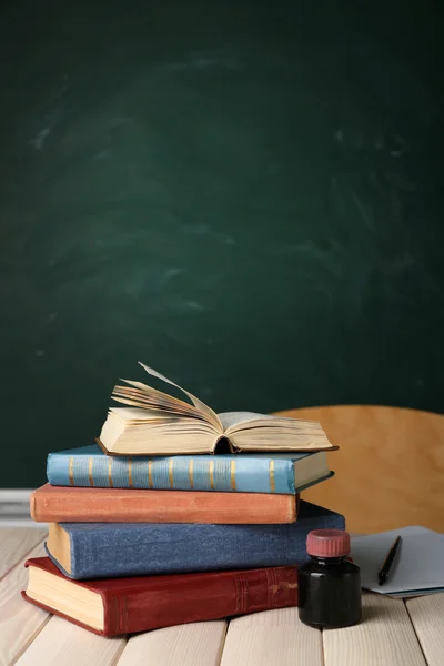 Stack of books on desk — Stock Photo, Image