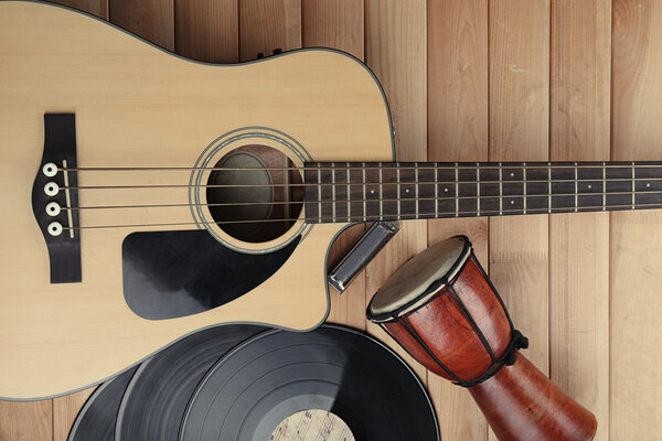 Guitar with vinyl records and African drum
