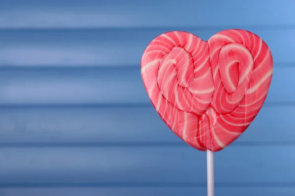 Bright lollipop in shape of heart — Stock Photo, Image