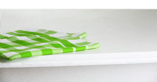 Wooden table with napkin — Stock Photo, Image