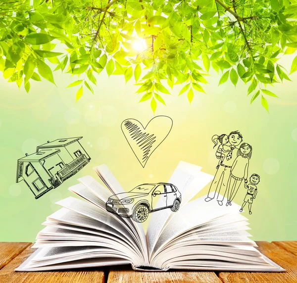 Open book with drawings on nature background — Stock Photo, Image