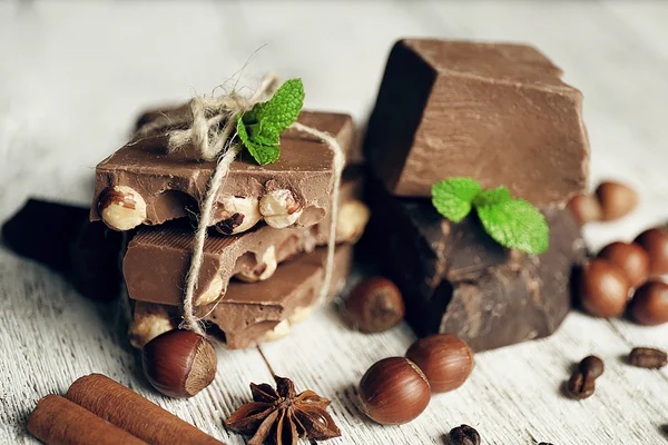 Set of chocolate on wooden table, closeup — Stock Photo, Image