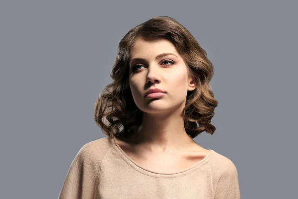 Portrait of beautiful model on gray background — Stock Photo, Image
