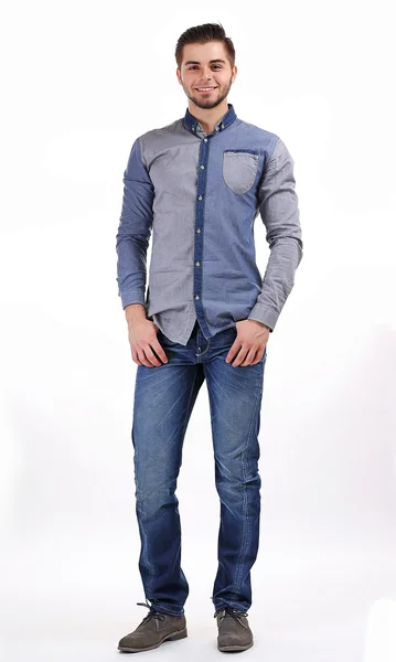 Uomo in camicia blu e jeans isolato su bianco — Foto Stock