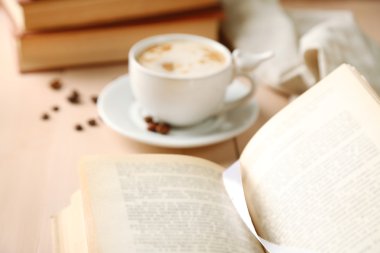Still life with cup of coffee and books, close up clipart