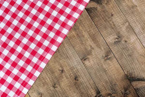 Checkered napkin on wooden table background — Stock Photo, Image