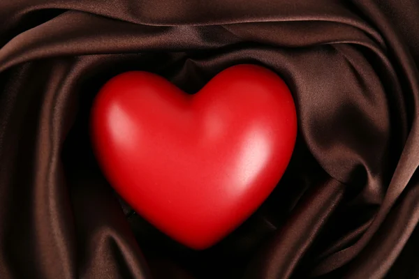 Red heart on fabric background — Stock Photo, Image