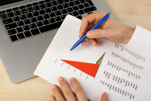 Businessman analyzing charts, closeup — Stock Photo, Image