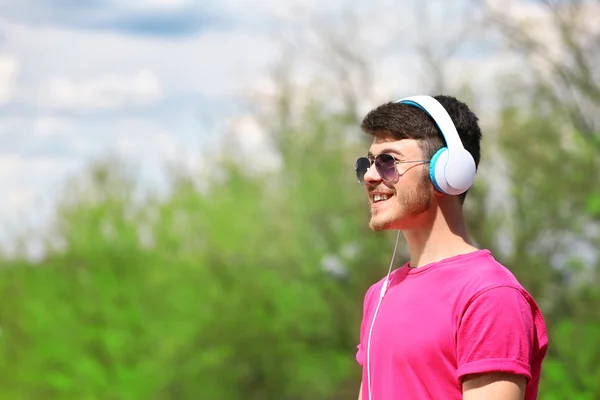 Man with headphones outdoors — Stock Photo, Image