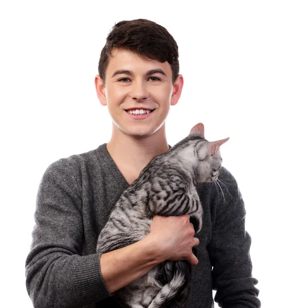 Handsome young man with cute cat isolated on white — Stock Photo, Image