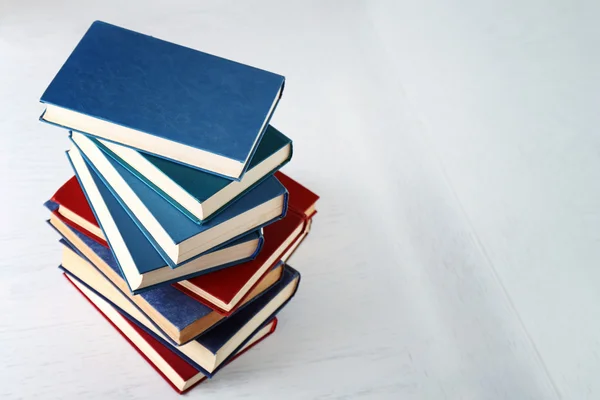 Stack of books on light background — Stock Photo, Image