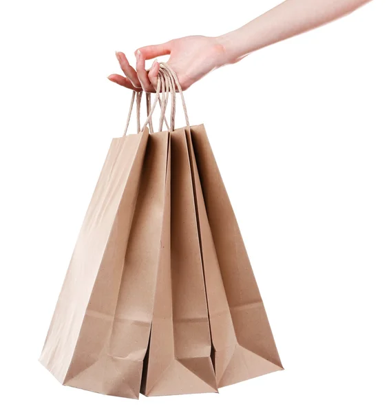 Kvinnliga handen håller papper shoppingväska isolerad på vit — Stockfoto