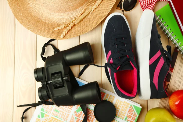 Female gumshoes with accessories on wooden background — Stock Photo, Image