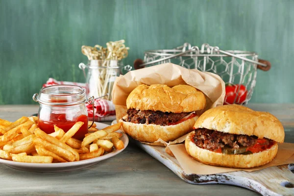 Tasty sandwiches and french fries on plate — Stock Photo, Image