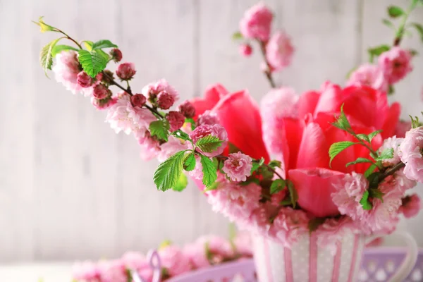 Spring bouquet in colorful mug — Stock Photo, Image