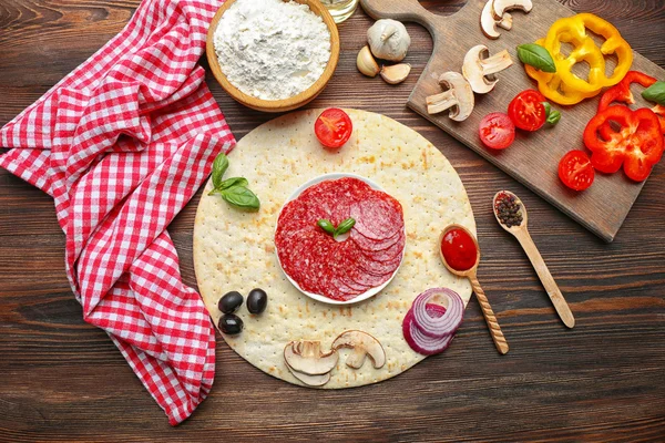 Ingredients for cooking pizza on wooden table — Stock Photo, Image