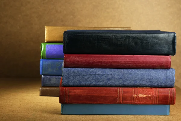 Old books on shelf, close-up, on wooden background — Stock Photo, Image