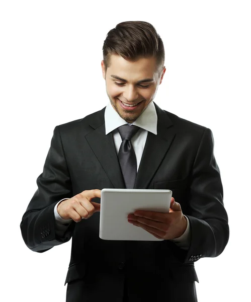 Elegante hombre de traje sujetando la tableta aislada en blanco — Foto de Stock