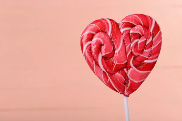 Bright lollipop in shape of heart — Stock Photo, Image