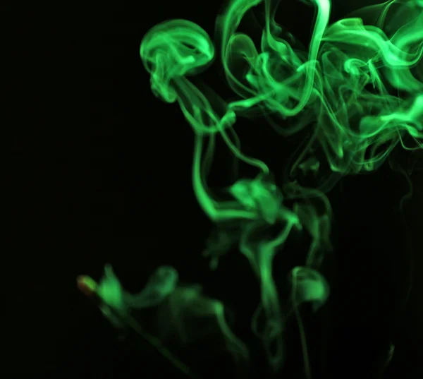 Color smoke from match on dark background — Stock Photo, Image