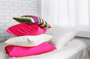colorful pillows in bedroom clipart