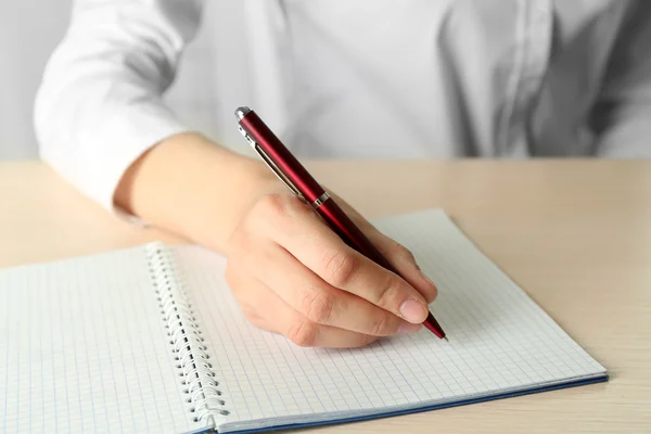 Businesswoman writing on document — Stock Photo, Image