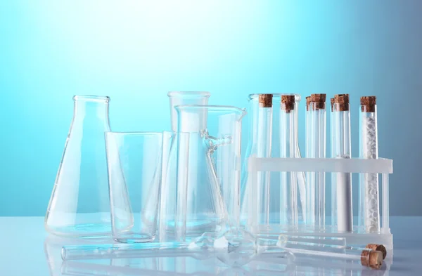 Empty laboratory test tubes  on blue background — Stock Photo, Image
