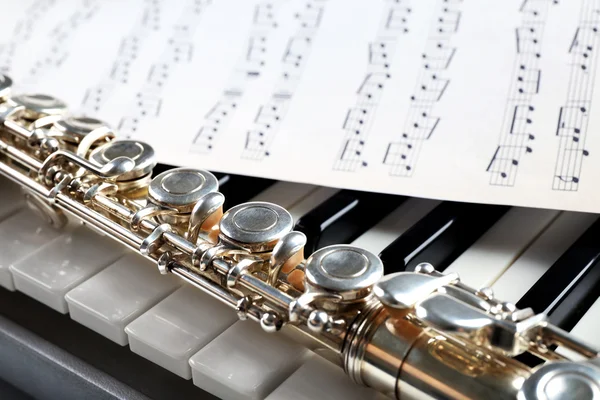 Flute and piano with music sheet close up — Stock Photo, Image