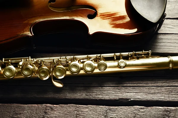 Flute with violin on table close up — Stock Photo, Image